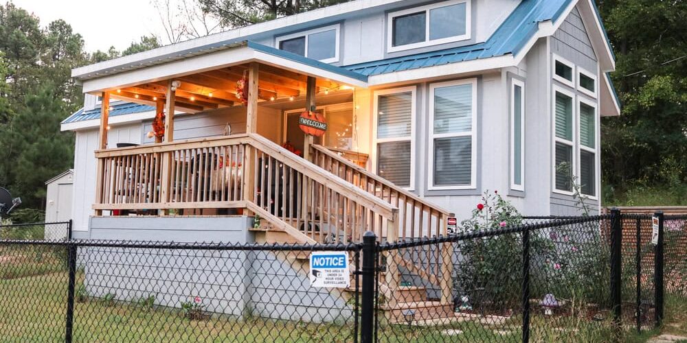 house surrounded by chain link fencing