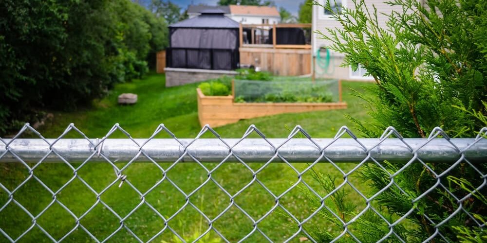 garden behind a chain link fence